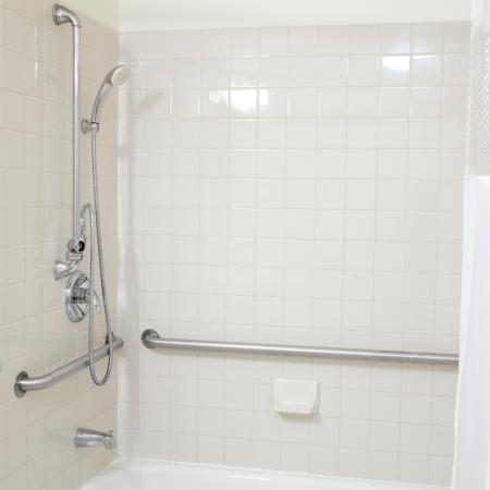 Shower in a seniors bathroom that has safety rails installed to ensure the senior can bathe safely 