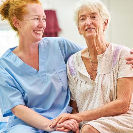 Caregiver helping frail senior