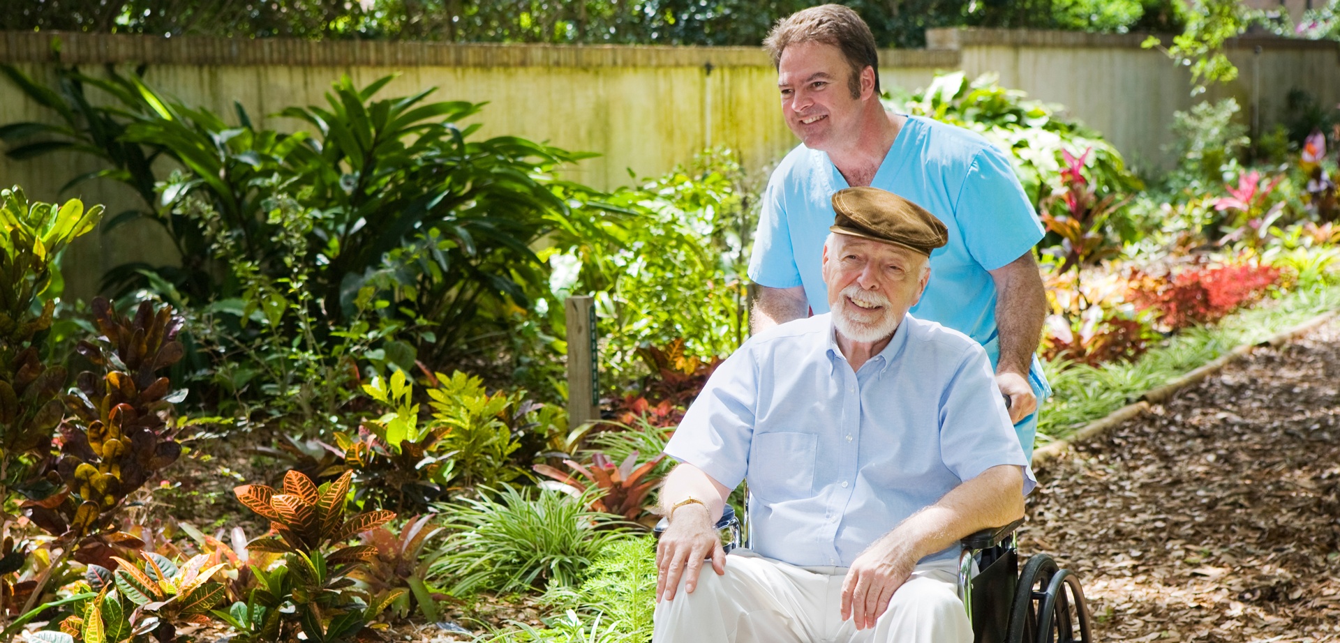 Caregiver with senior in garden