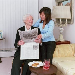 Chinese caregiver with a senior male