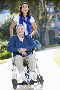 Caregiver with man in wheelchair