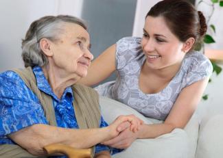 Caregiver and grateful senior