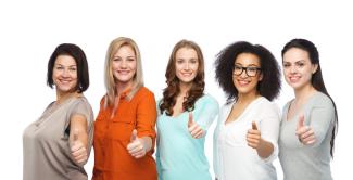 5 women giving thumbs up