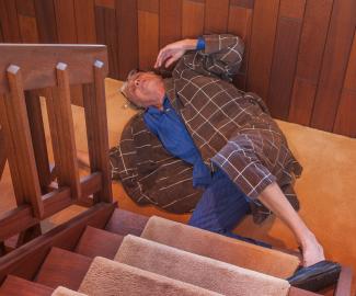Elderly man falling down stairs