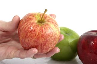 Holding apple