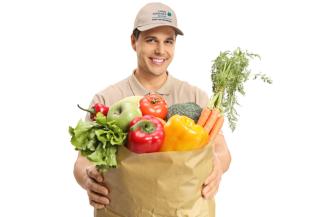Young man with grocery delivery