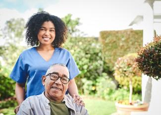 Caregiver supporting senior at home