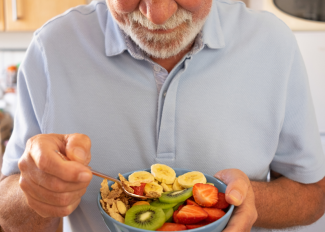 Senior man eating healthy snack