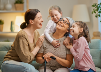 Grandmother spending time with granddaughters and daughter on Mother's Day