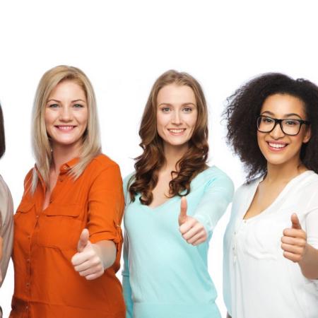 5 women giving thumbs up