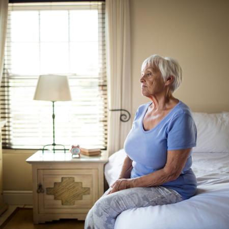Elderly woman alone in nursing home