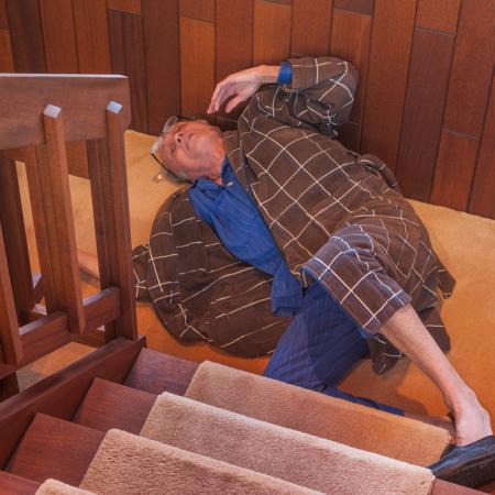 Elderly man falling down stairs
