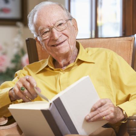 Senior male reading a book