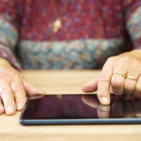 Senior using tablet