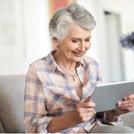 Woman looking at photos on a tablet