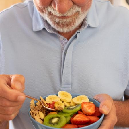 Senior man eating healthy snack