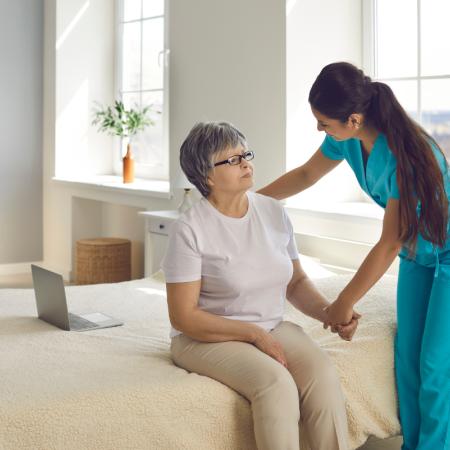 Caregiver providing respite homecare services to senior
