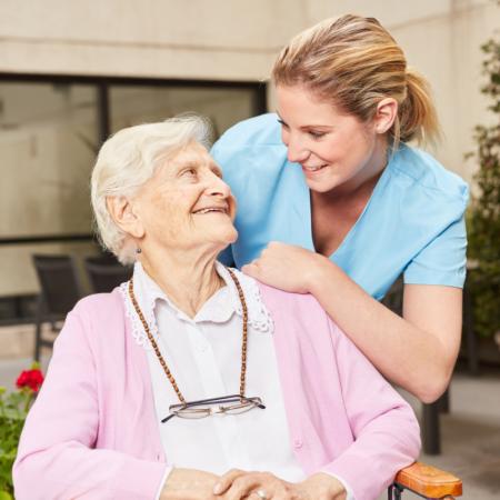 Caregiver providing respite care to senior while family is away