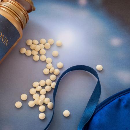 Melatonin pills and eye mask to aid in sleeping. Is it safe for seniors to take melatonin?