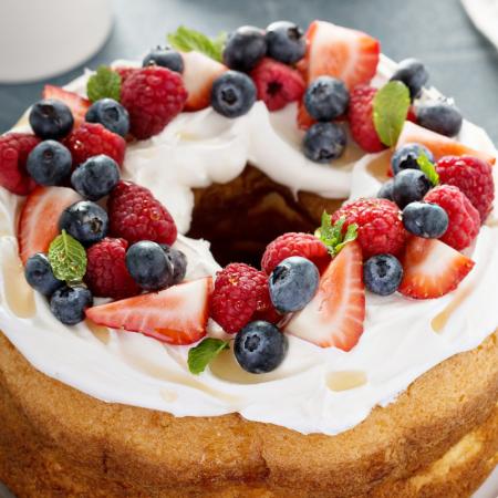 Low sugar dessert for senior. Angel food cake with cream and berries.
