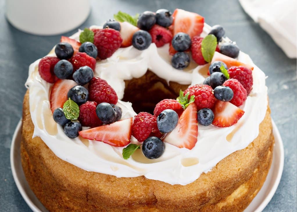 Low sugar dessert for senior. Angel food cake with cream and berries.
