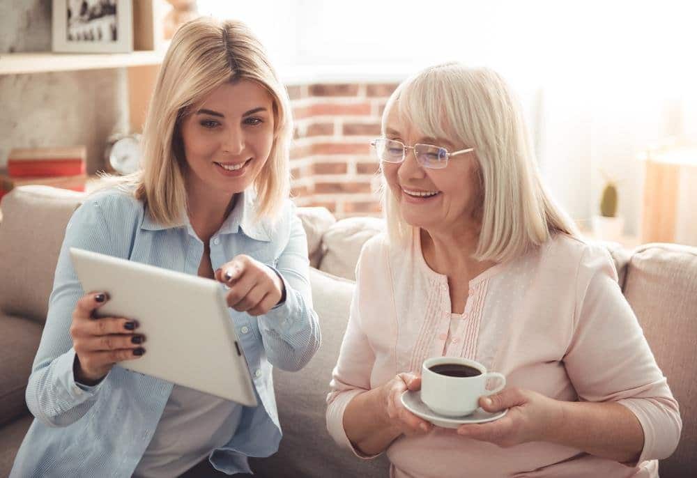 Caregiver showing senior home care options